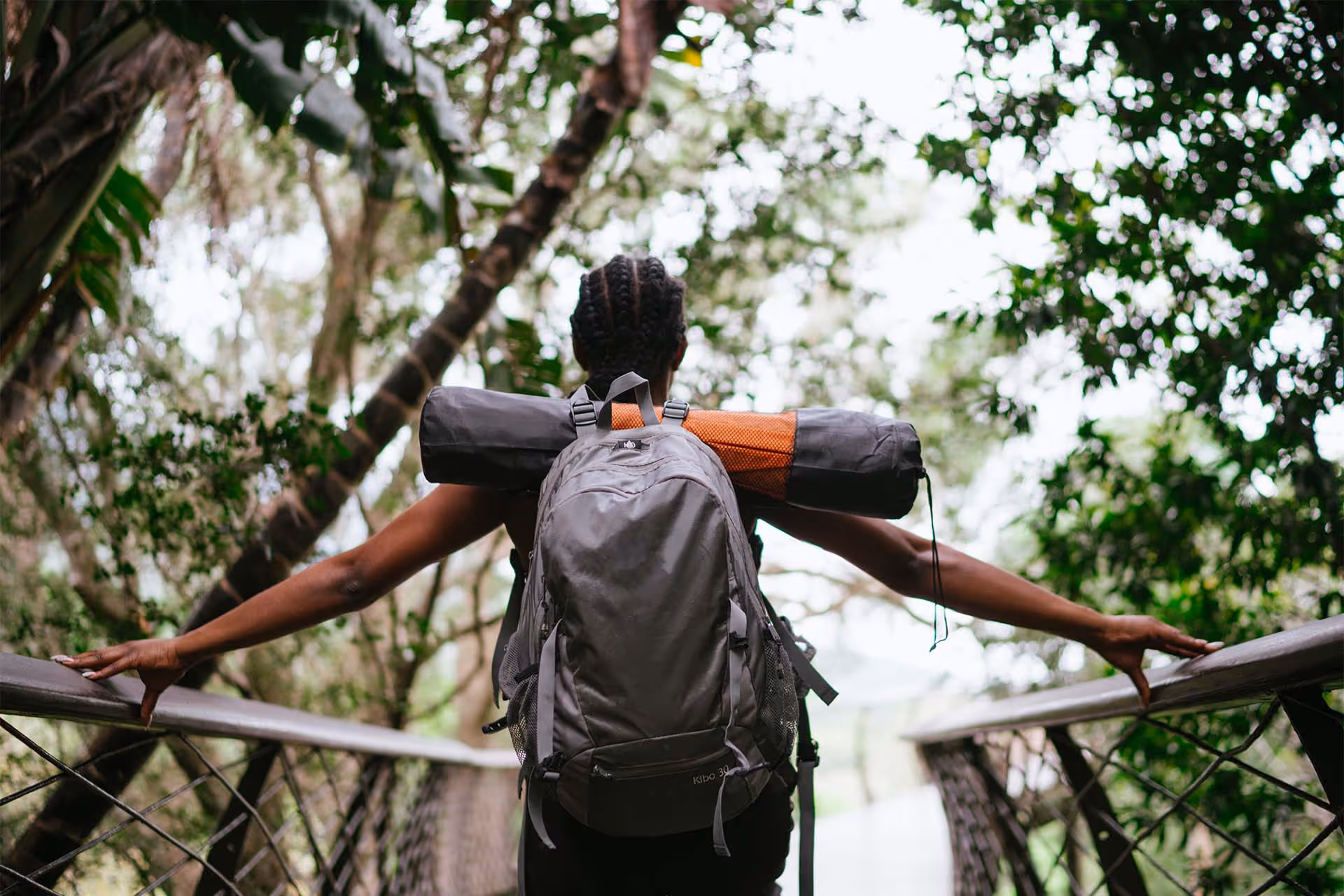 Girl in the forest with a backpack